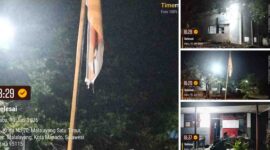 Bendera Negara kusam, robek, terpasang sampai malam hari di Kantor PAM Malalayang 
